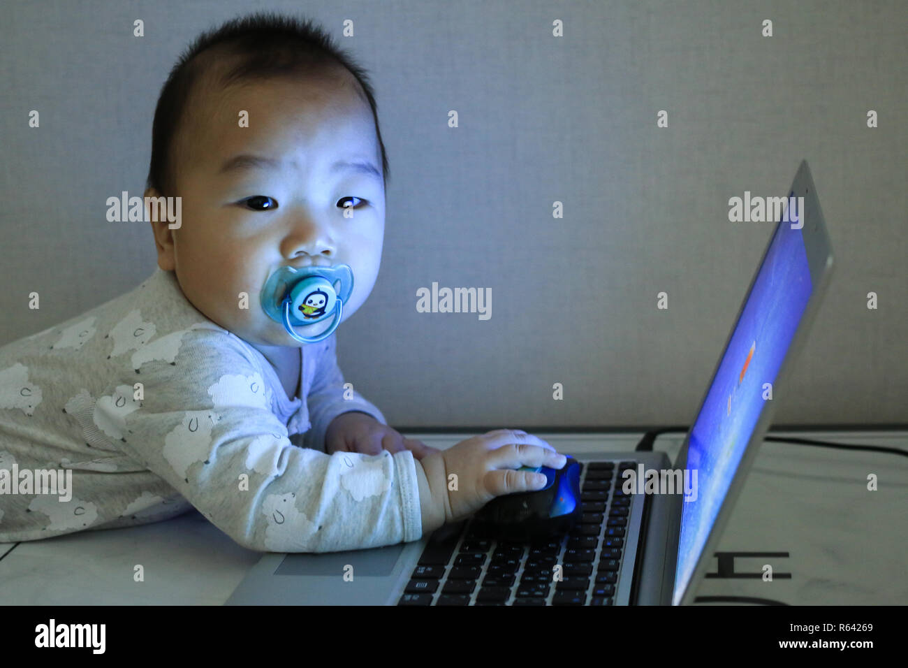 Baby with smart look hi-res stock photography and images - Alamy