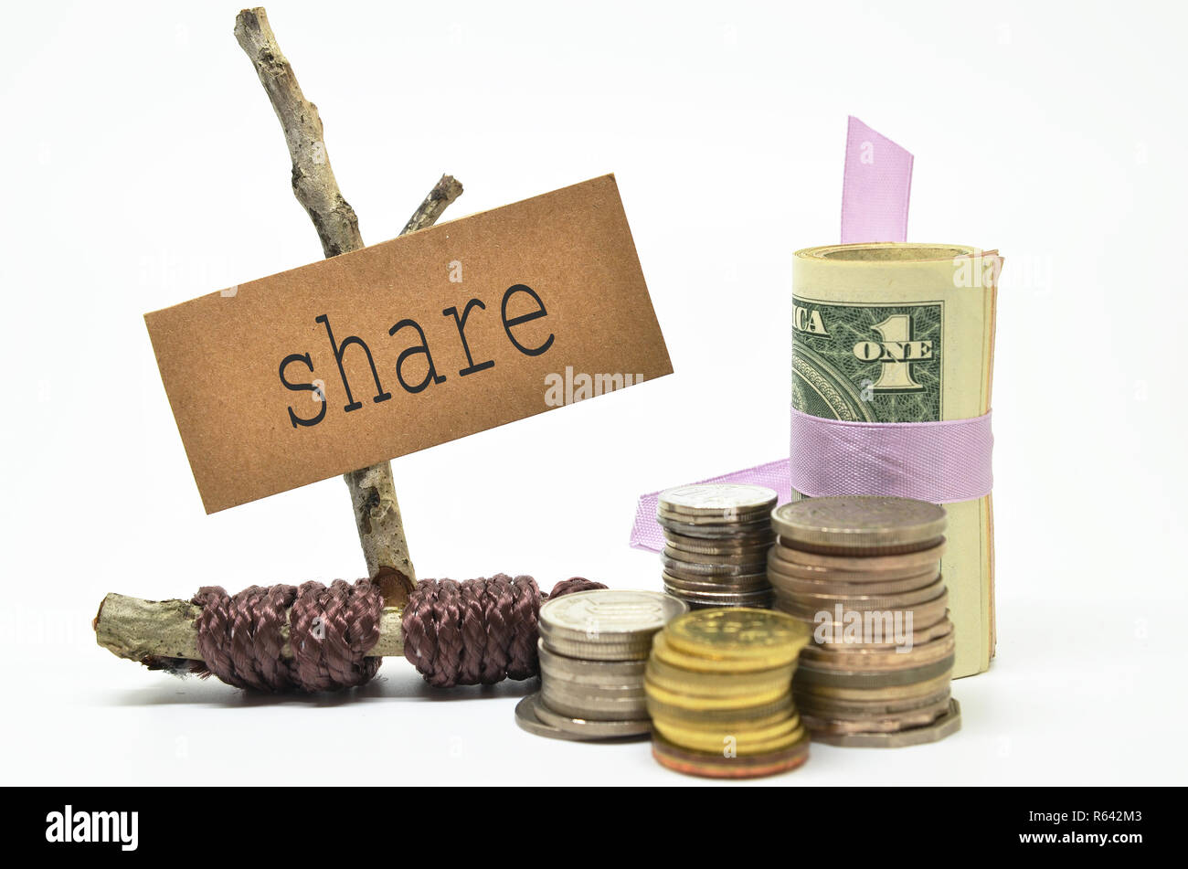 Coins and money with share label Stock Photo - Alamy