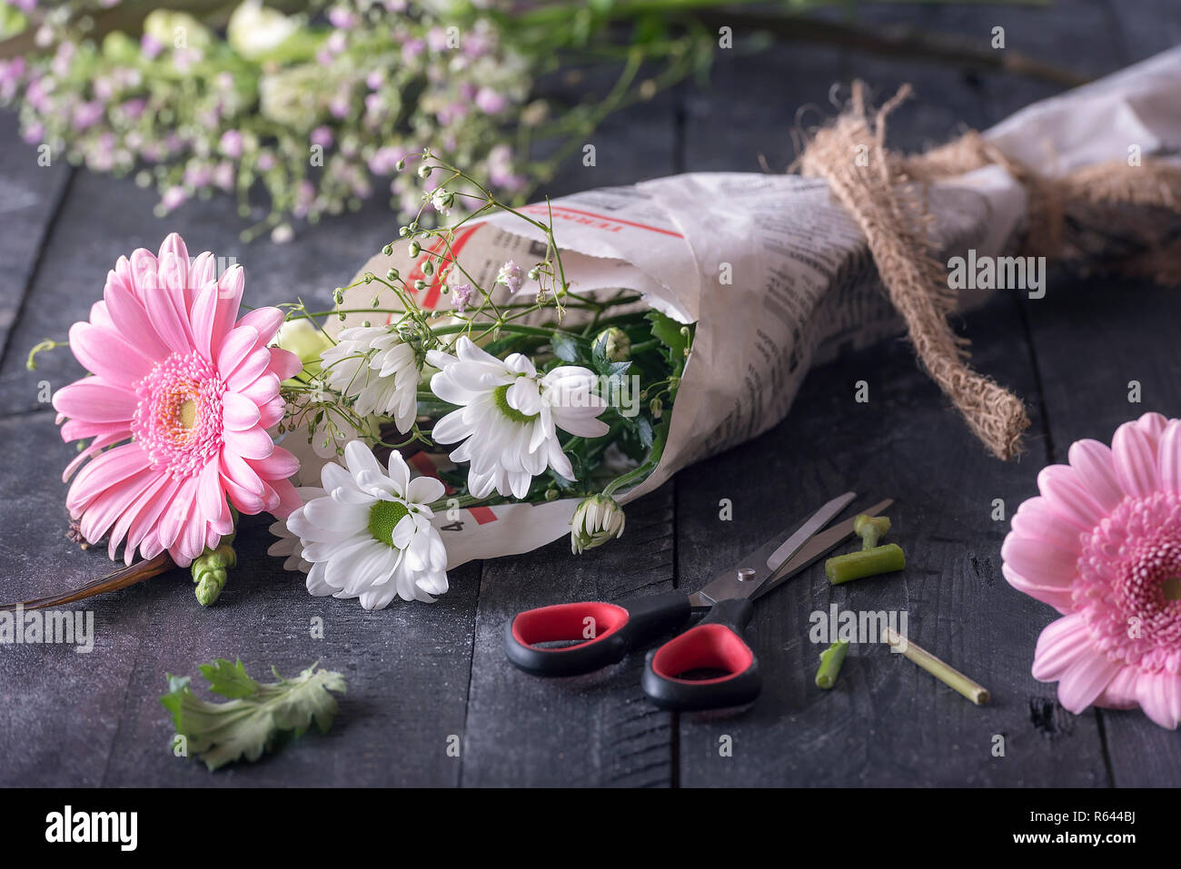 Flowers wrapped in newspaper Stock Photo Alamy