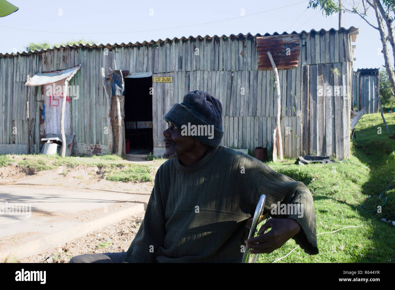 Eastern Cape, Keiskammahoek, South Africa 20 Nojozi sits beside a plot