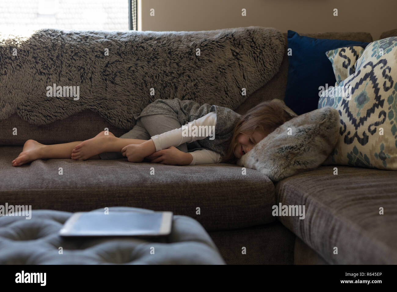 Girl relaxing on sofa hi-res stock photography and images - Alamy