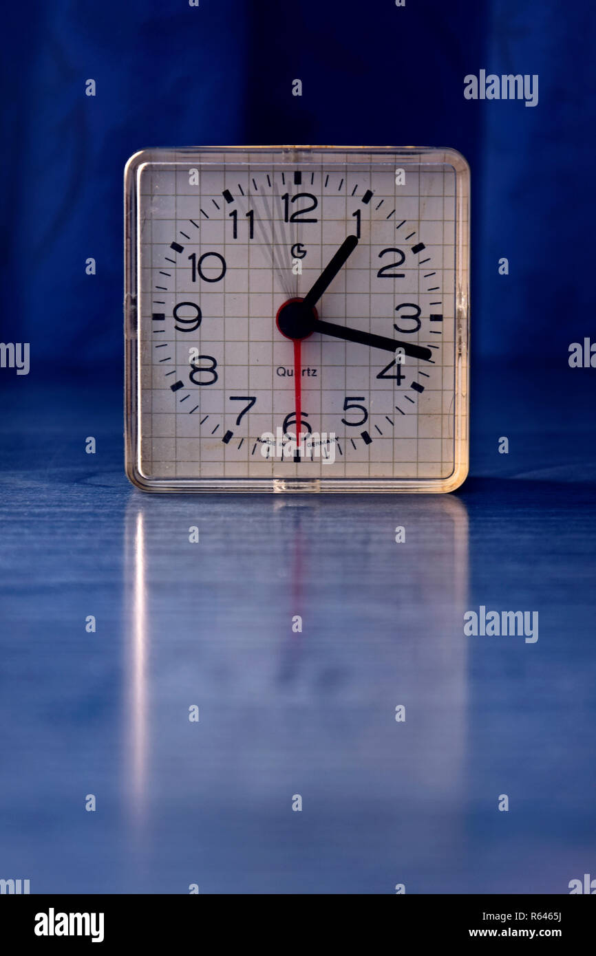 Analog quartz clock showing in 5 second exposure by time lapse the