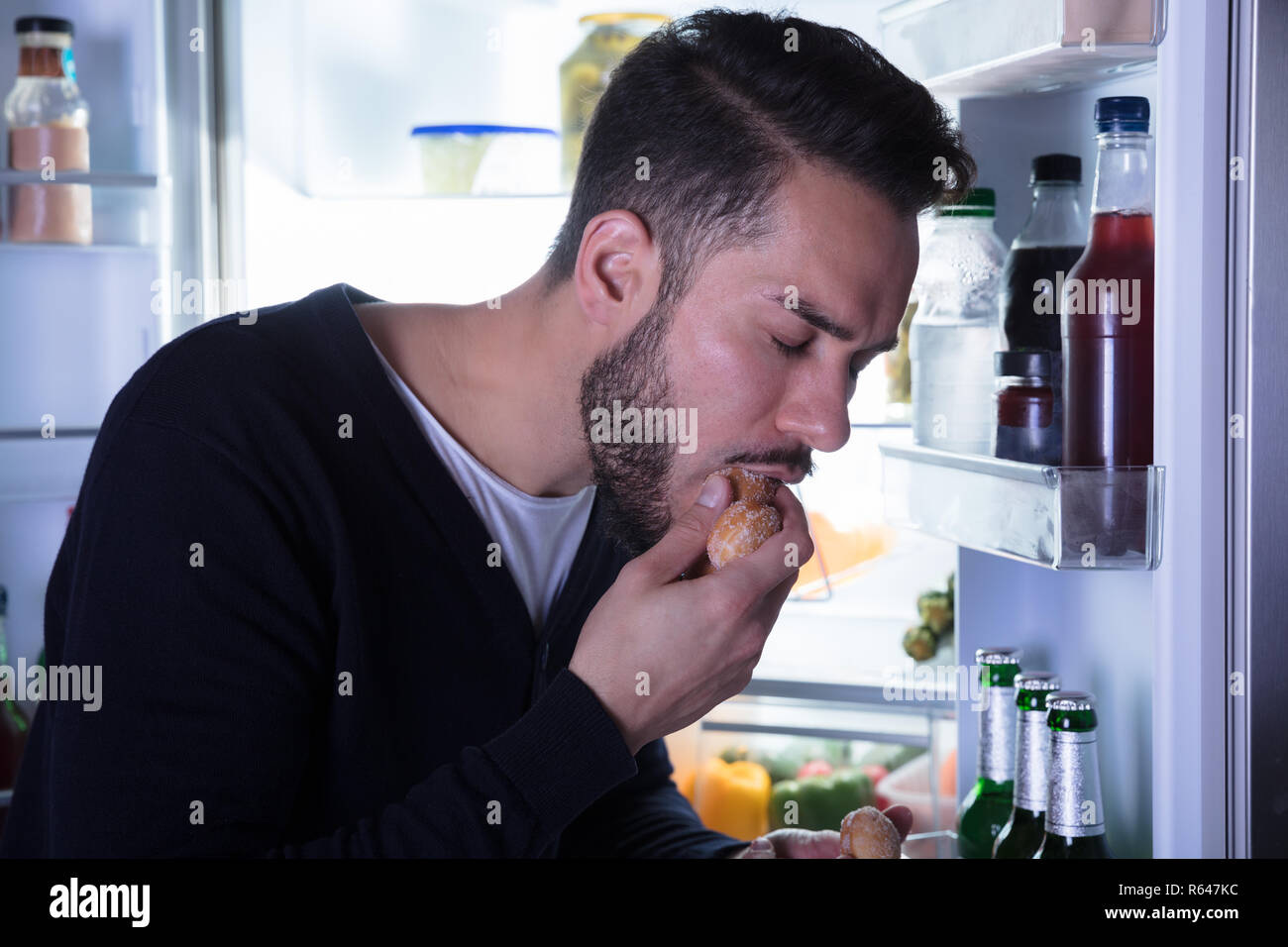 Close-up Of A Man Eating Cookie Stock Photo