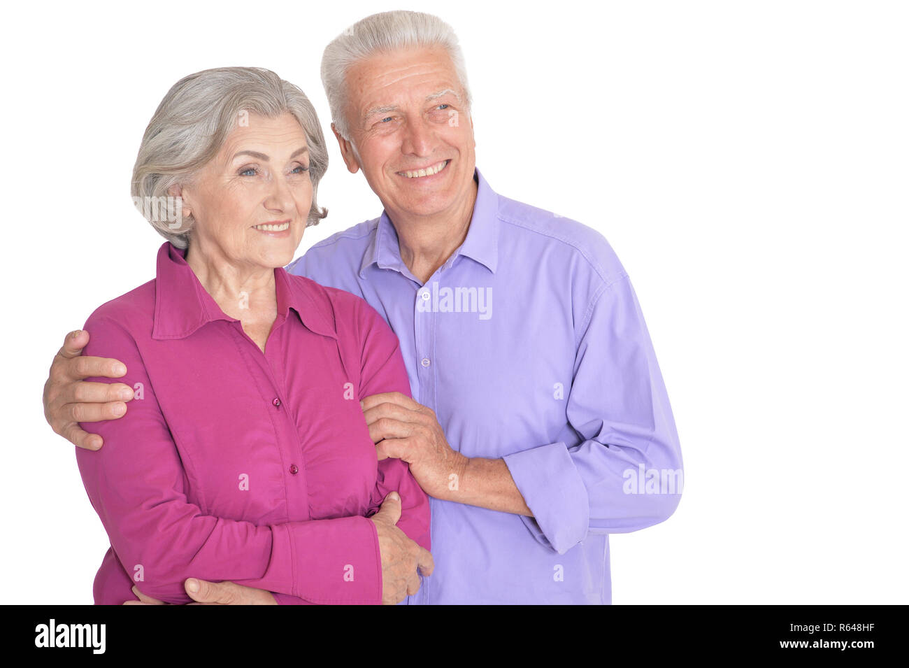 Happy senior couple posing isolated on white background Stock Photo