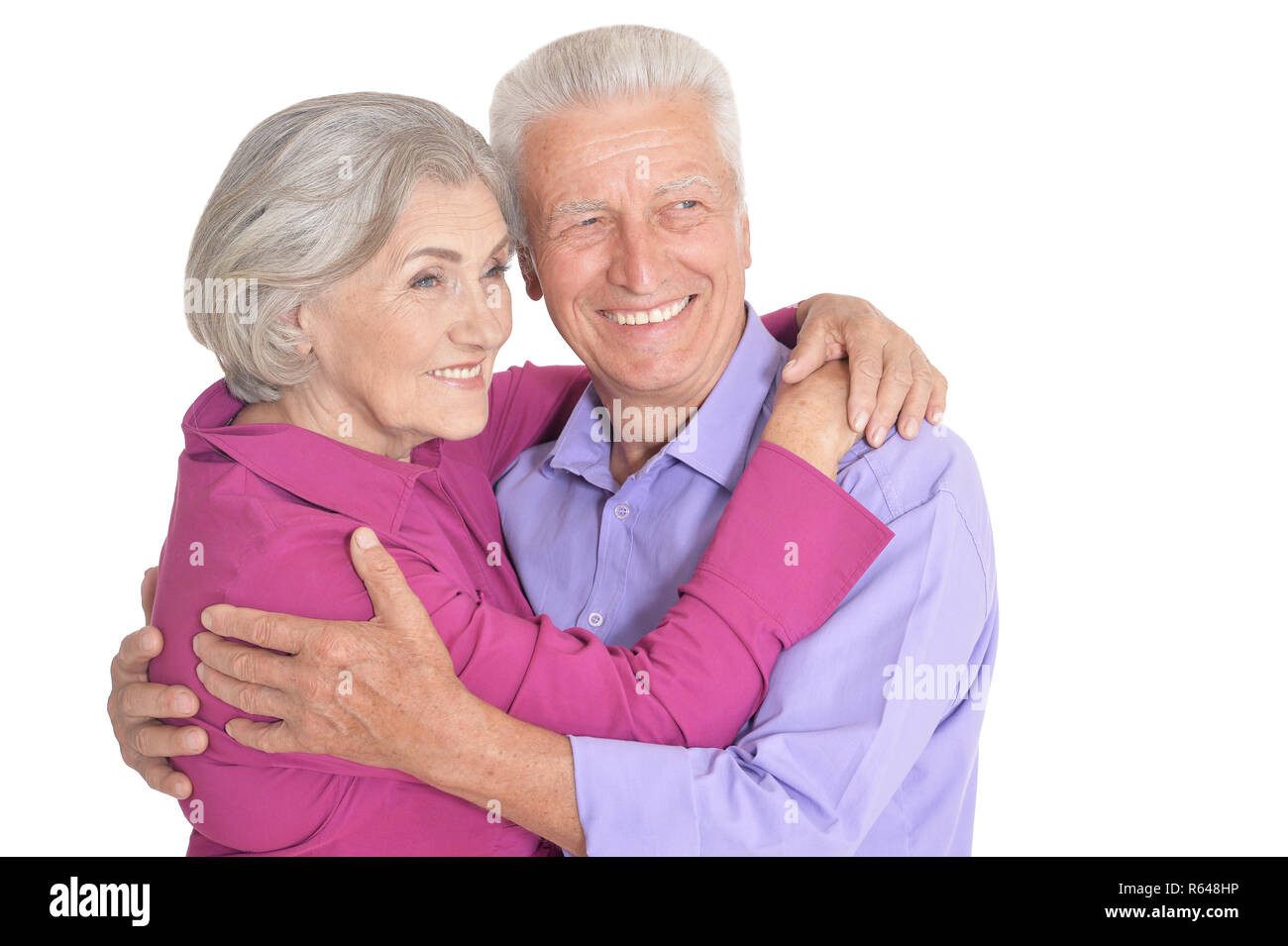 Happy senior couple posing isolated on white background Stock Photo