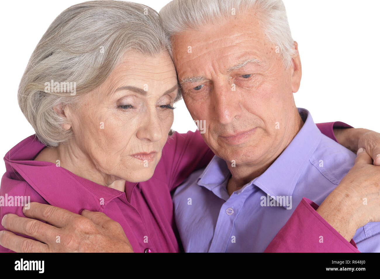 Sad senior couple isolated on white background Stock Photo