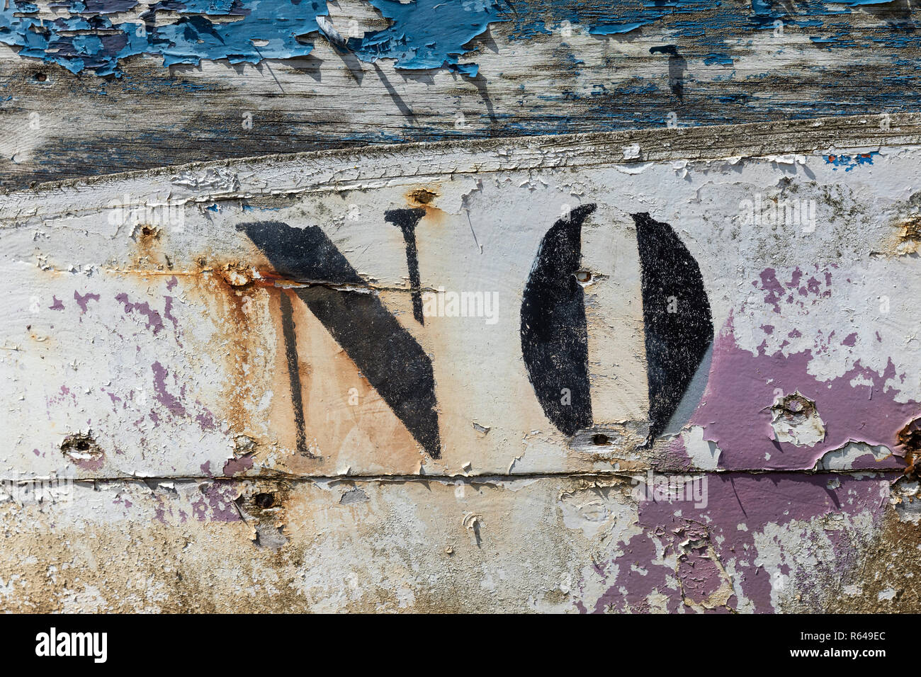 NO (Abbreviation of Noirmoutier) on the shell of a wreck at the Noirmoutier boat cemetery (Vendee, France) Stock Photo