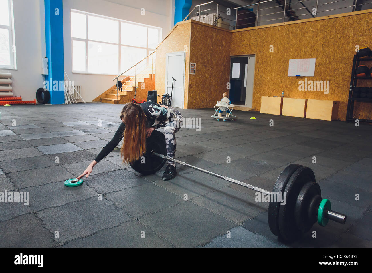 Attractive Young Sports Woman With Barbell Deadlift Dropped The
