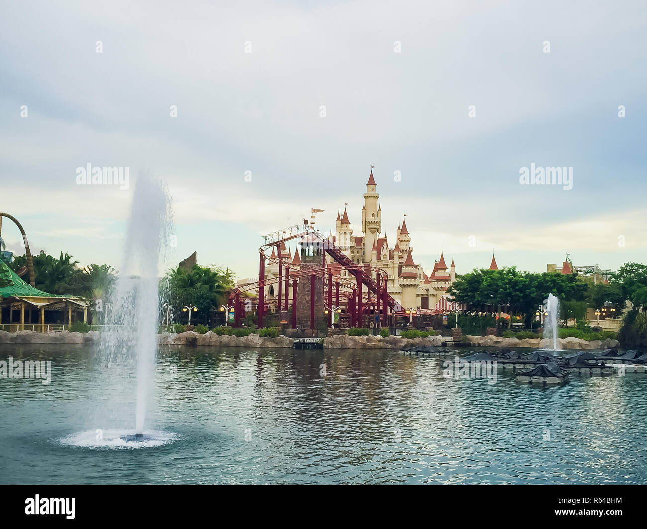 SINGAPORE - APRIL 11: Beautiful castle and roller coaster in Universal Studios on April 18, 2017. Universal Studios Singapore is theme park located within Resorts World Sentosa, Singapore. Stock Photo