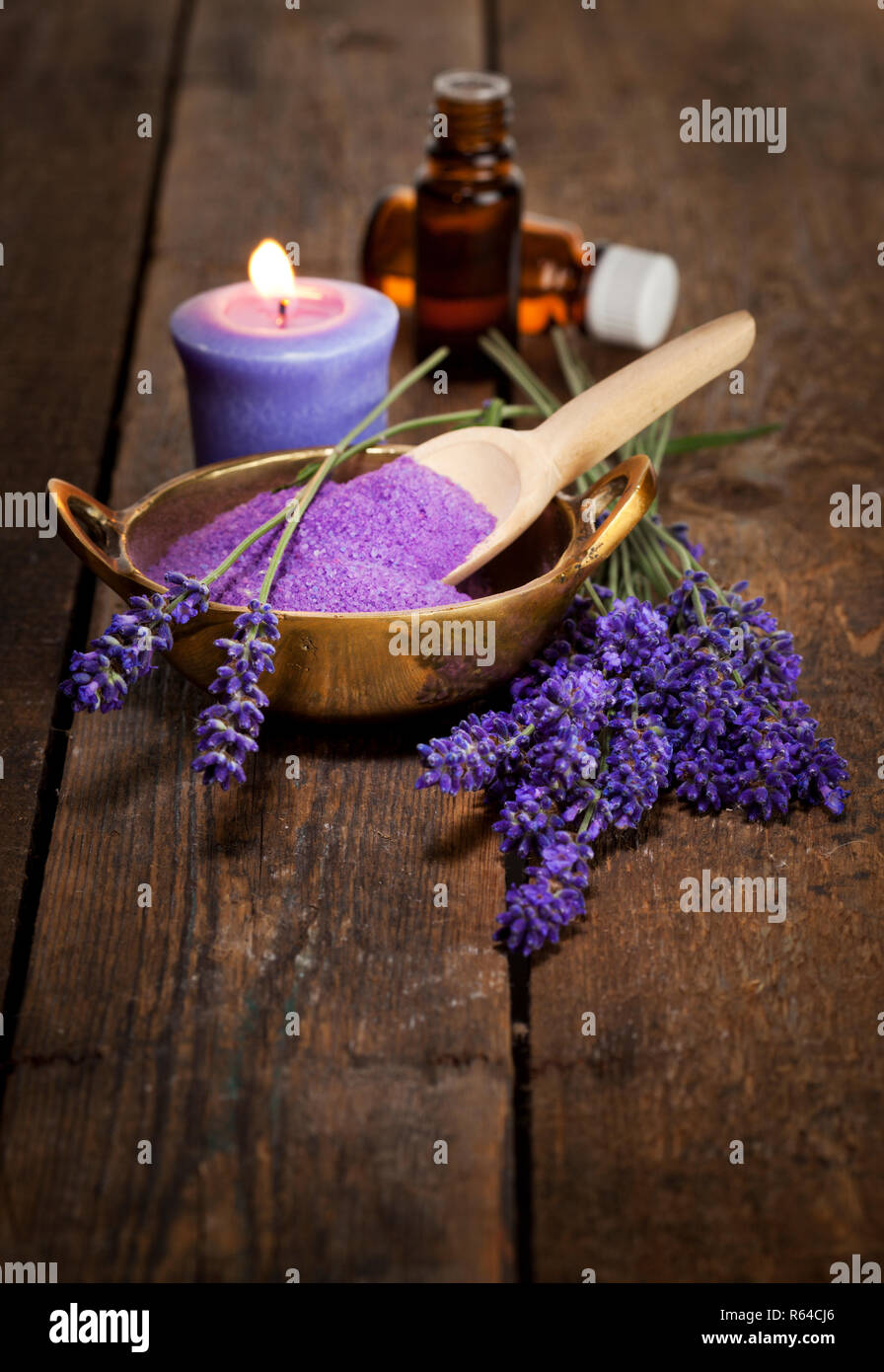 Lavnder flowers, bath salt and essential oils on wooden surface Stock Photo