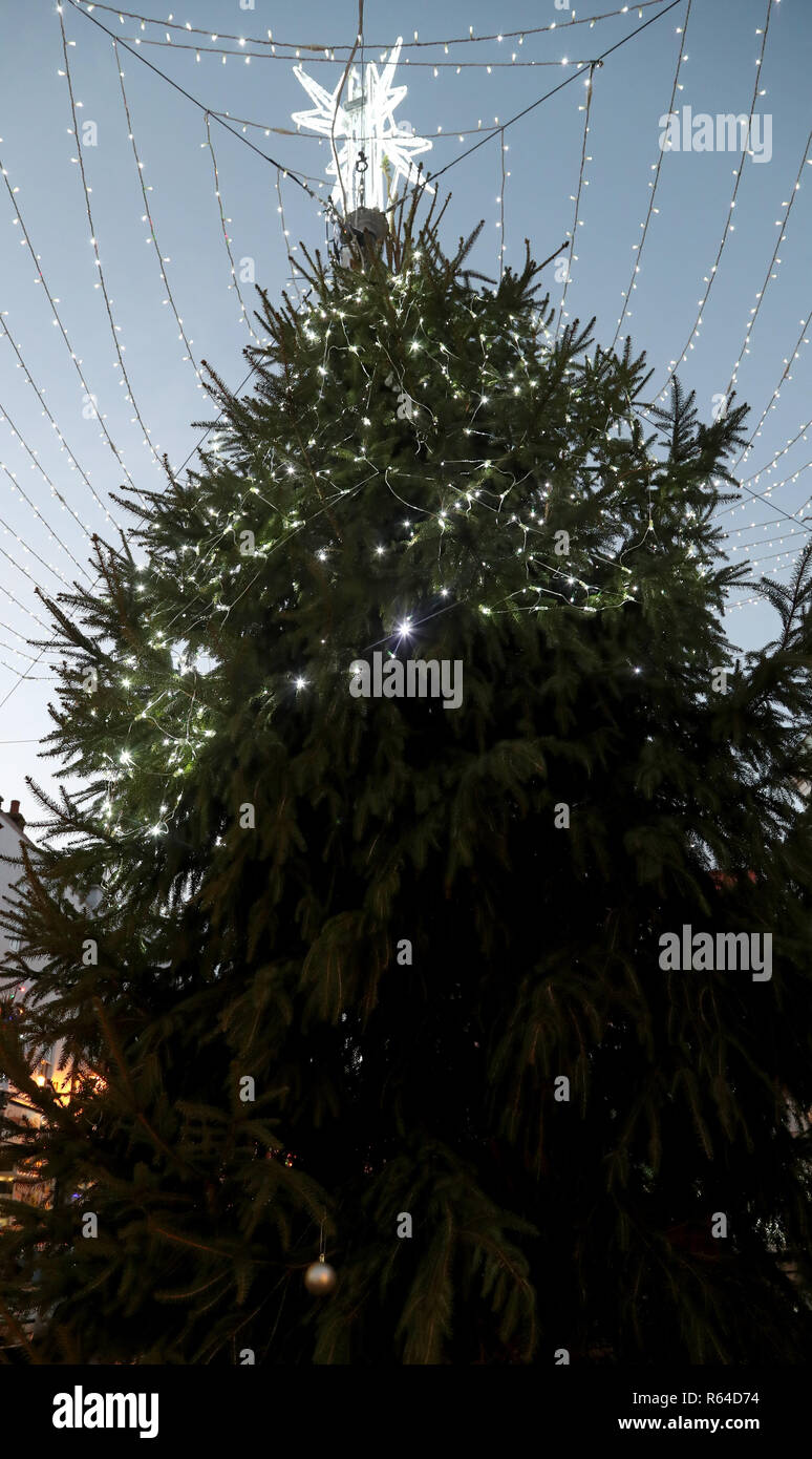 A view of the Christmas tree in Faversham, Kent, as volunteers have decided to only light the top of the tree in a bid to stop the tree being damaged by anti-social behaviour. Stock Photo