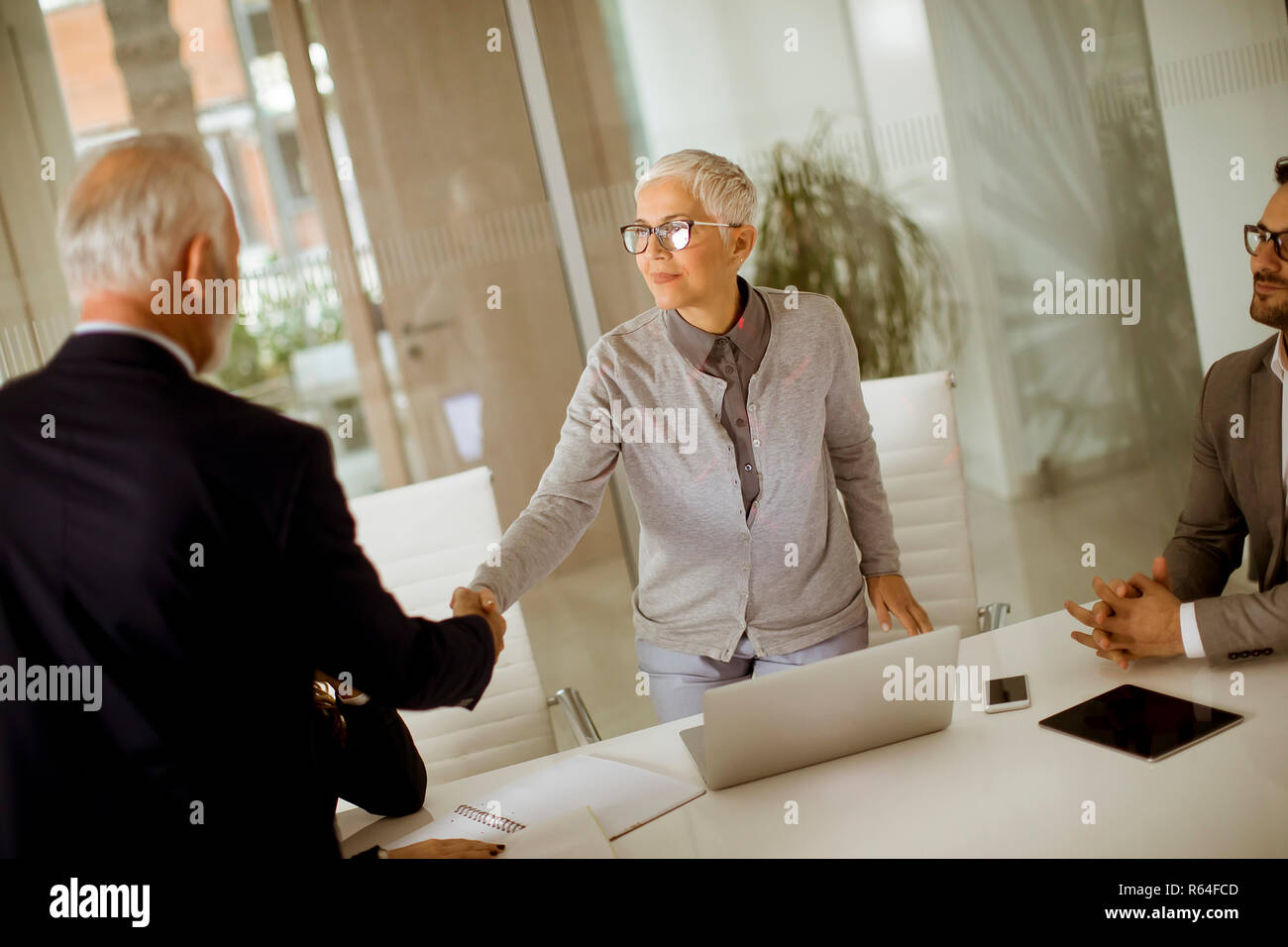 Business people successfully completed the meeting Stock Photo - Alamy