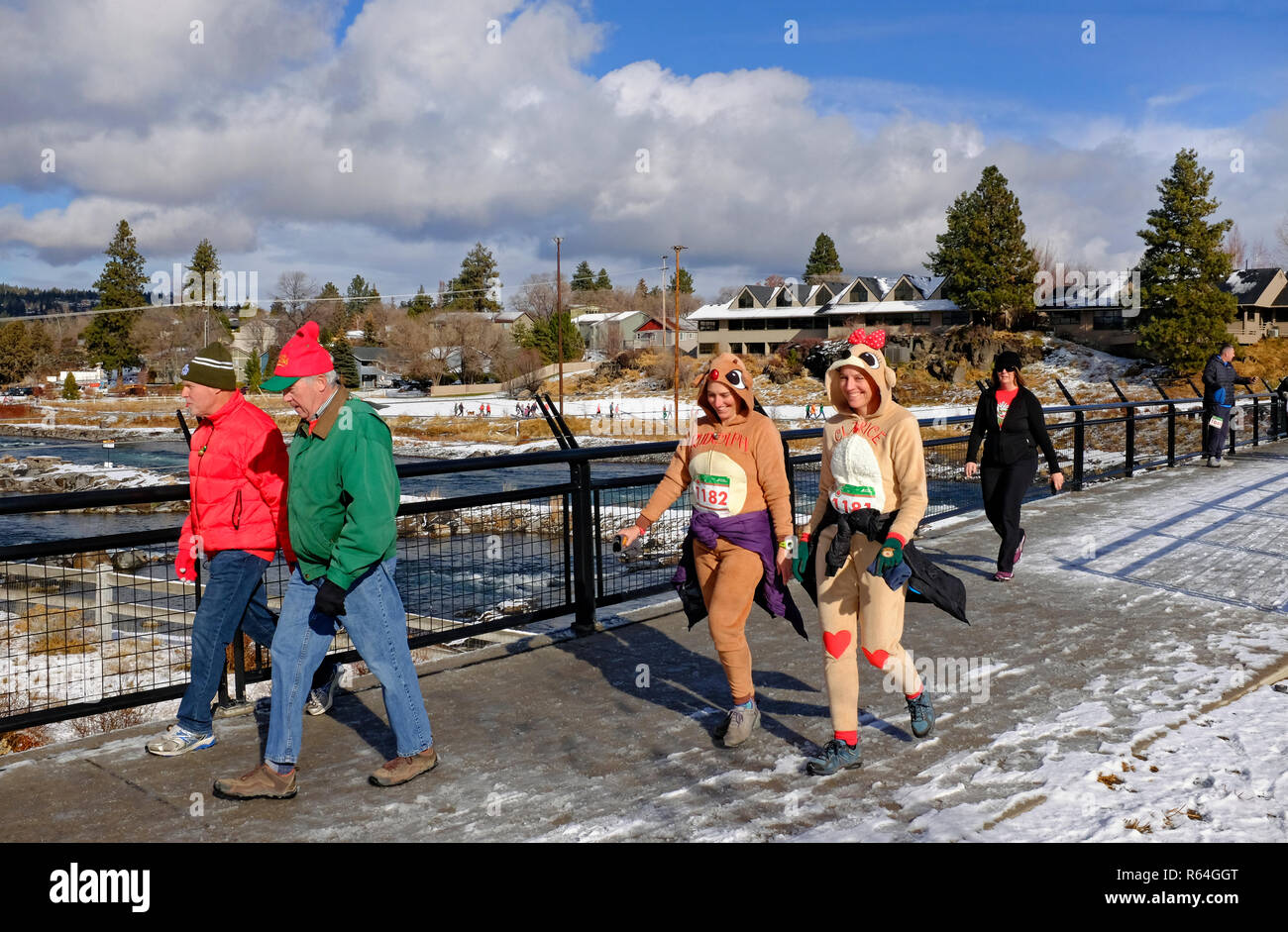 Runners and walkers in costume take part in an annual charity event that supports the Arthritis Foundation called the Jingle Bell Run, held in Bend, O Stock Photo