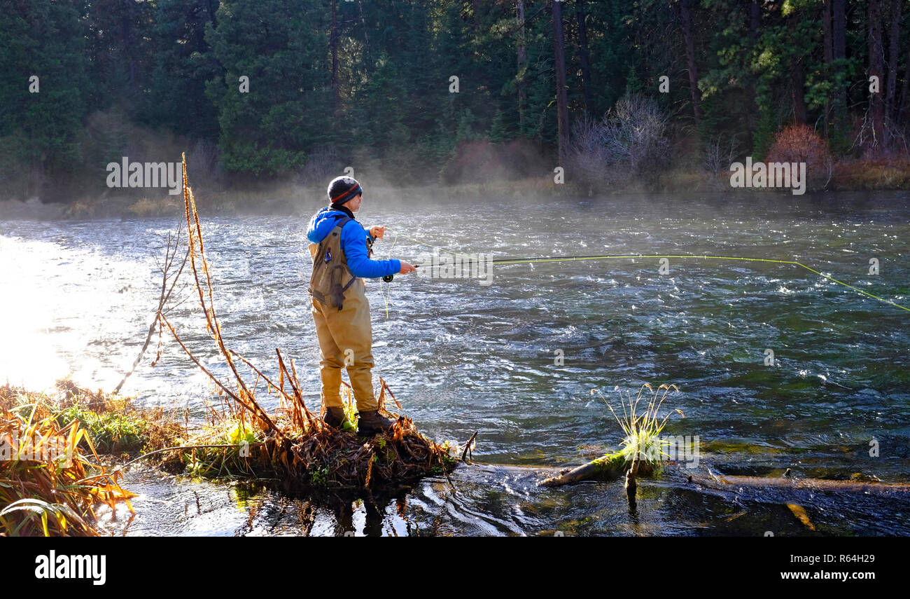 A morning mist rises from the Metolius River in the Cascade Mountains