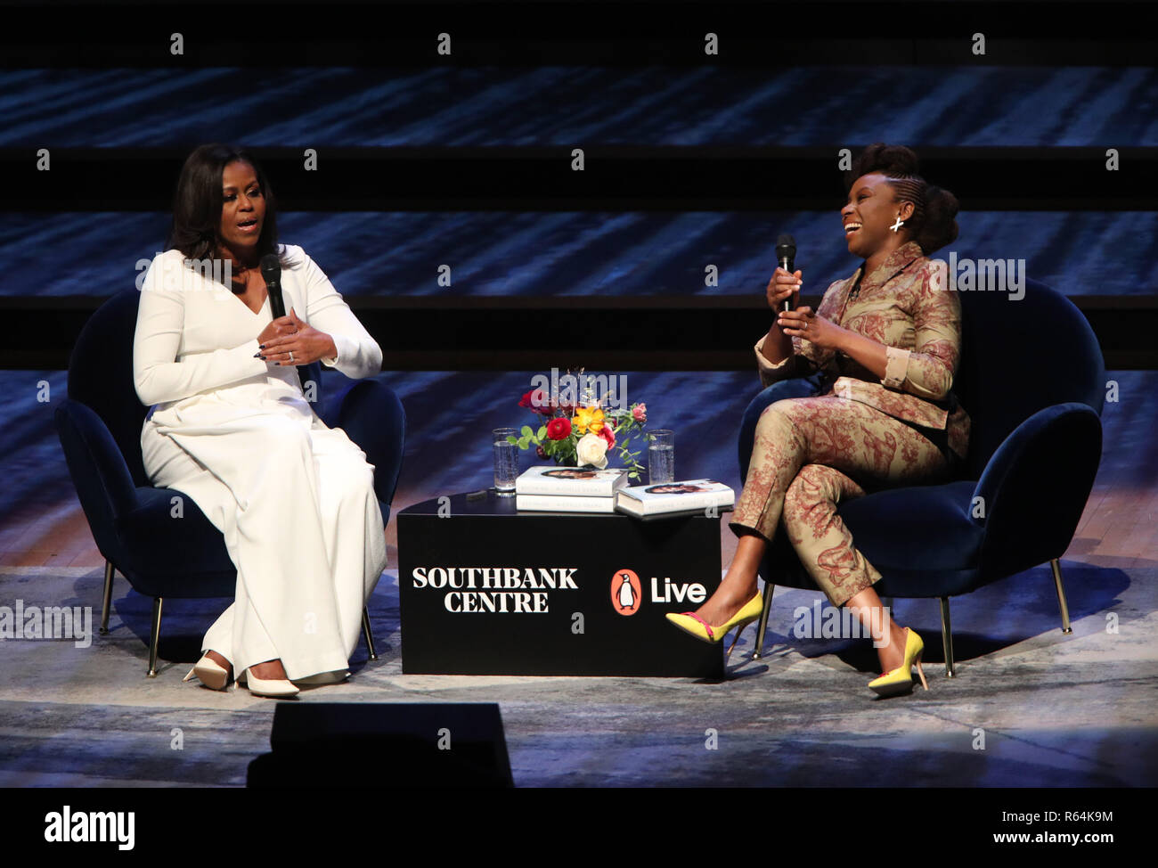 Michelle Obama (left) in conversation with writer Chimamanda Ngozi Adichie at the Royal Festival Hall in London during her visit to the UK to publicise her memoir Becoming, which tells of her personal journey to becoming First Lady and her time in the White House. Stock Photo