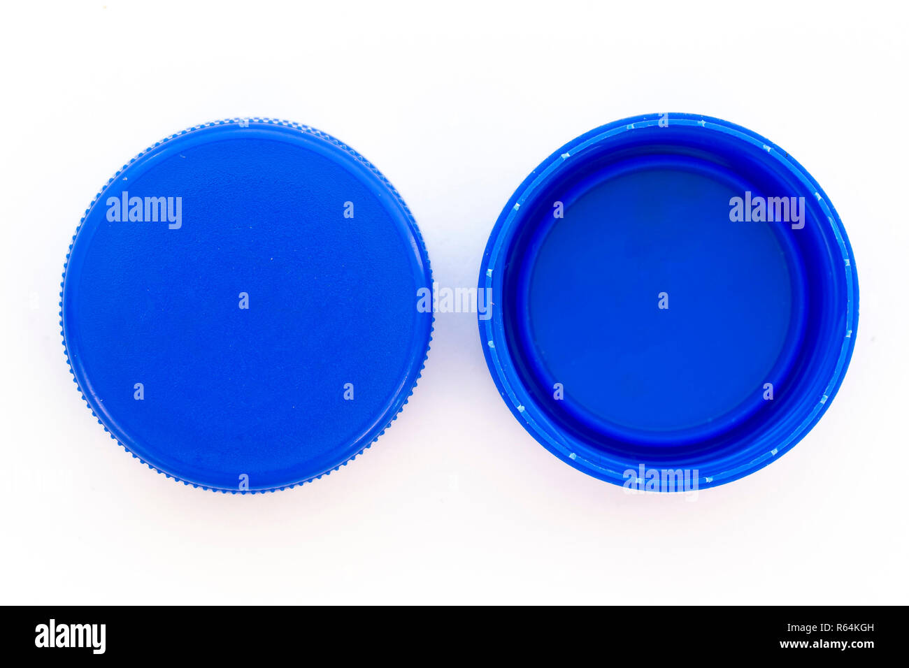 Blue plastic bottle caps. Studio shot. Plastic waste. Isolated on a