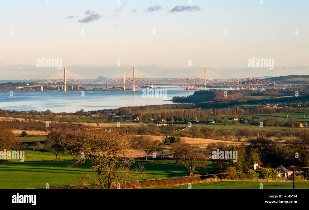 Three bridges, the Queensferry Crossing, Forth Road bridge, and Forth Rail Bridge spanning the Firth of Forth between North and South Queensferry. Stock Photo