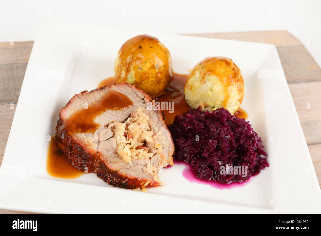 roast with dumplings and red cabbage Stock Photo Alamy