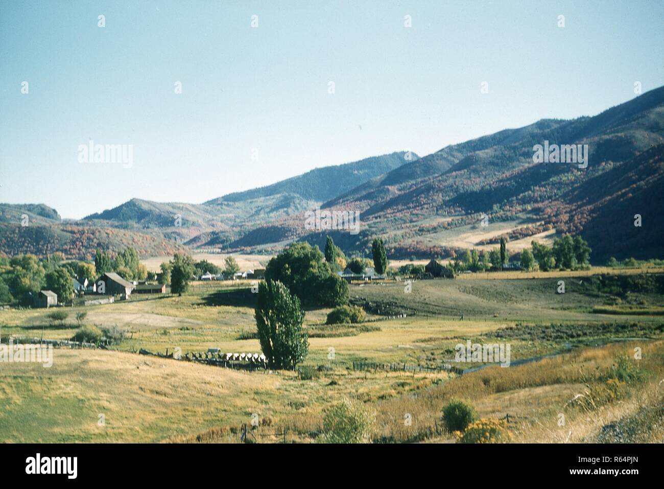 Panoramic scene of the Wasatch Range mountain valley town of Heber, Utah, June, 1958. () Stock Photo