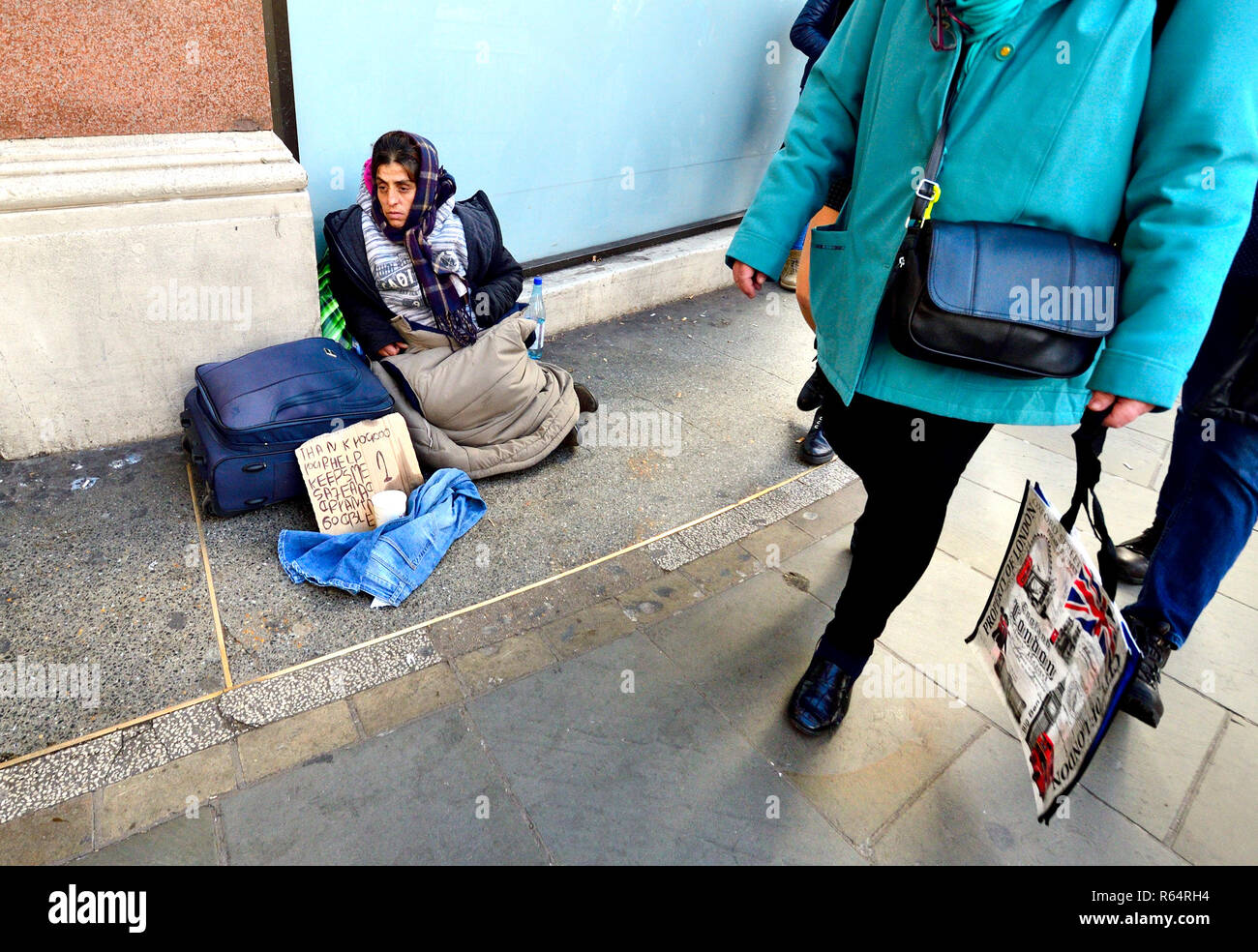 Homeless woman begging in Trafalgar Square, London, England, UK. Stock Photo