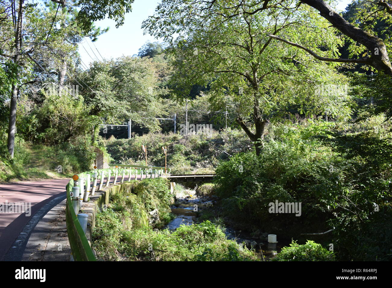 Rural road by stream, Ura Takao, Hachiouji, Toyko Stock Photo