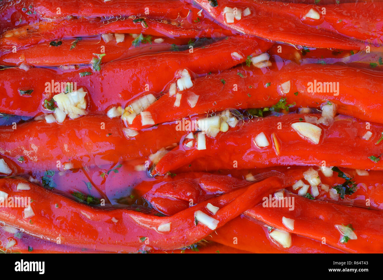 Salad of red peppers and garlic in a pickle Stock Photo