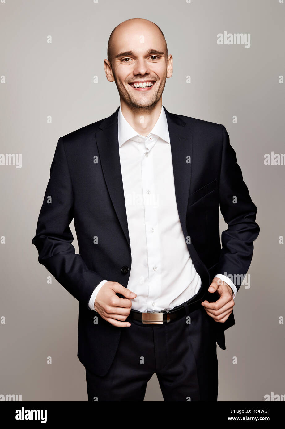 Cheerful man in sharp suit hi-res stock photography and images - Alamy