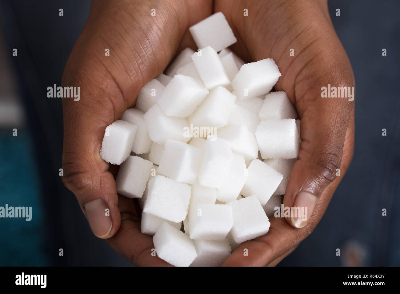 Human Hand Holding Sugar Cubes Stock Photo Alamy