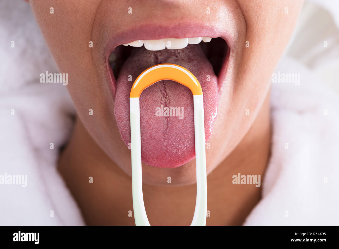 Woman Cleaning Tongue Stock Photo Alamy