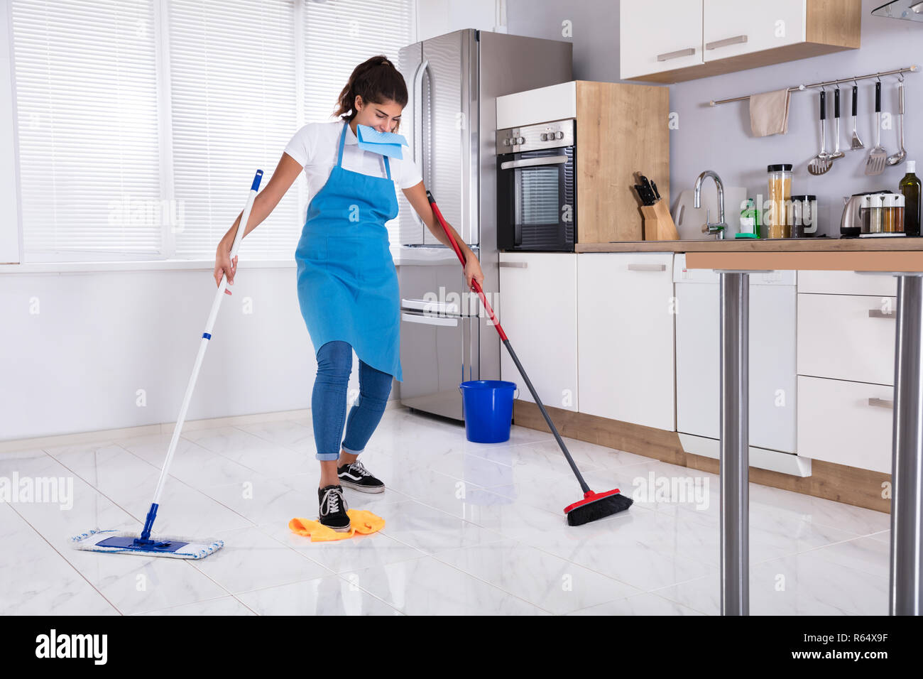 Female Janitor Multitasking Stock Photo - Alamy