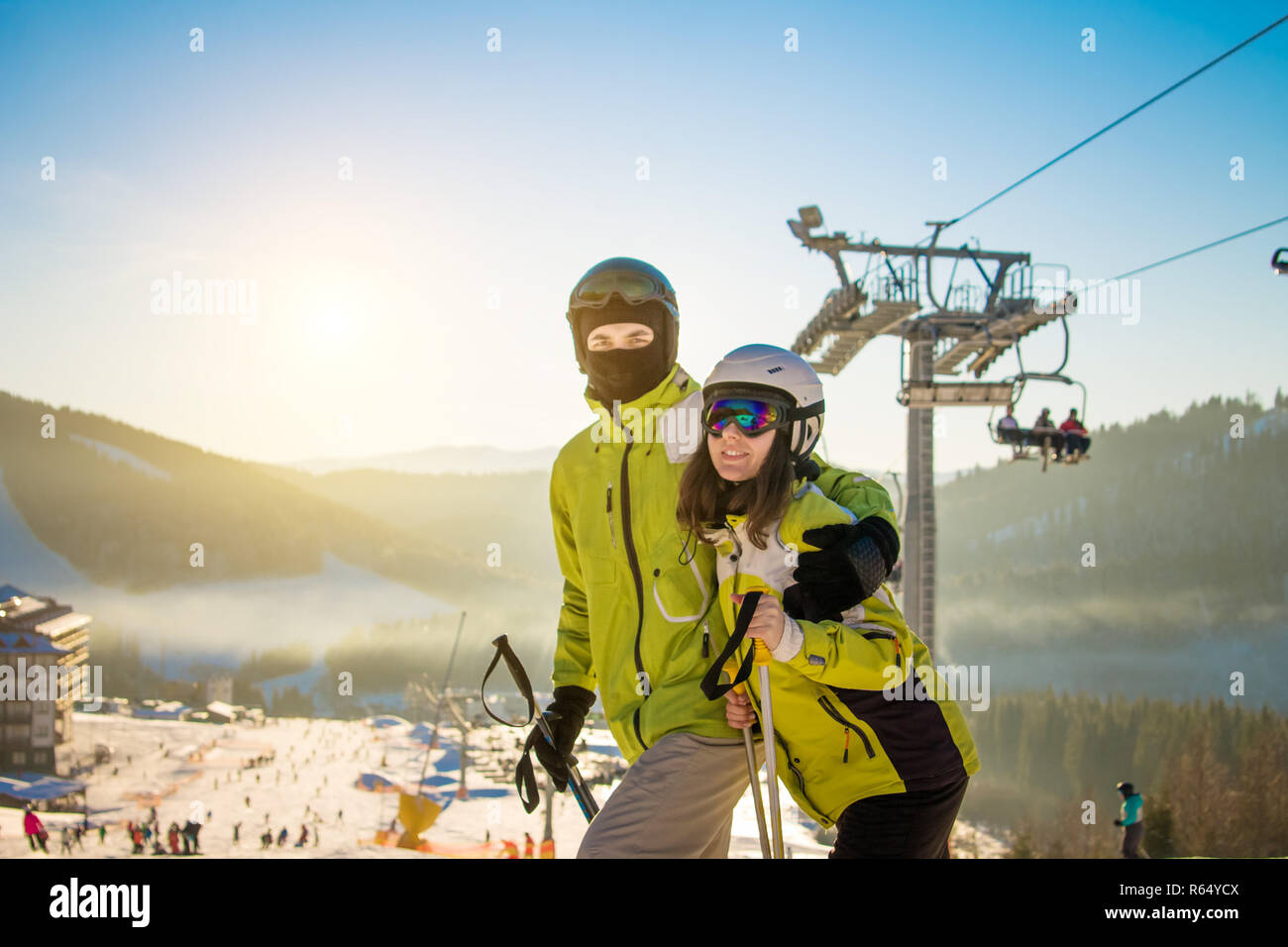 Young couple is skiing in Carpathian mountains. Happy people having fun on winter holidays Stock Photo