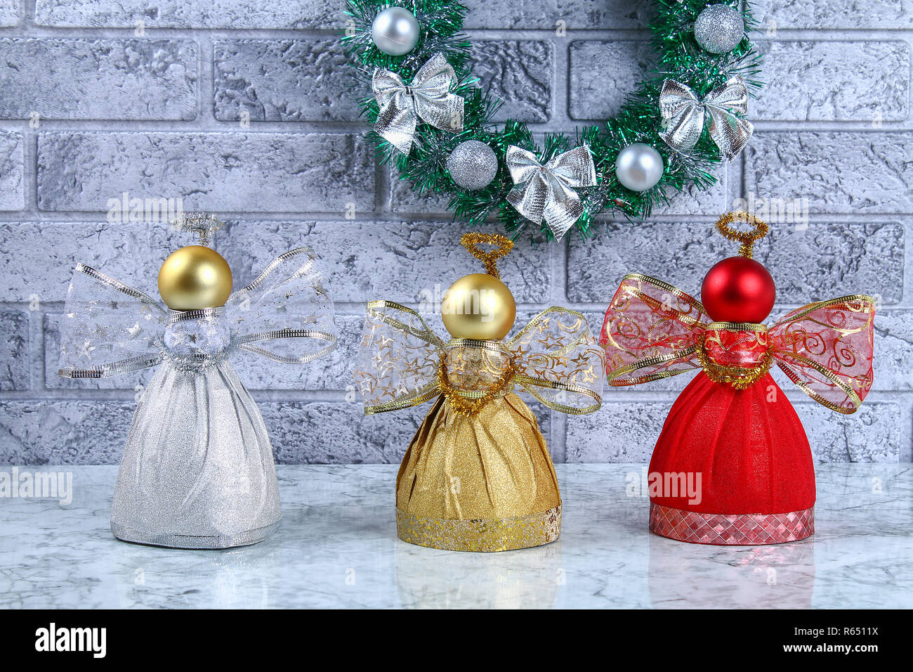 Diy Angel plastic bottle. Guide on the photo how to make a decorative angel  from a bottle, self-adhesive shiny paper, ribbon and a Christmas ball with  Stock Photo - Alamy