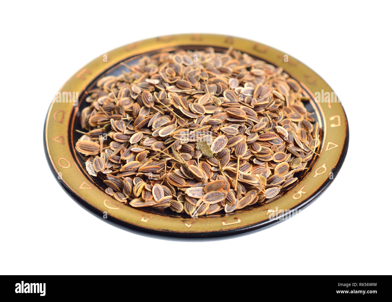 Stack of Dill seeds isolated on white background. Stock Photo