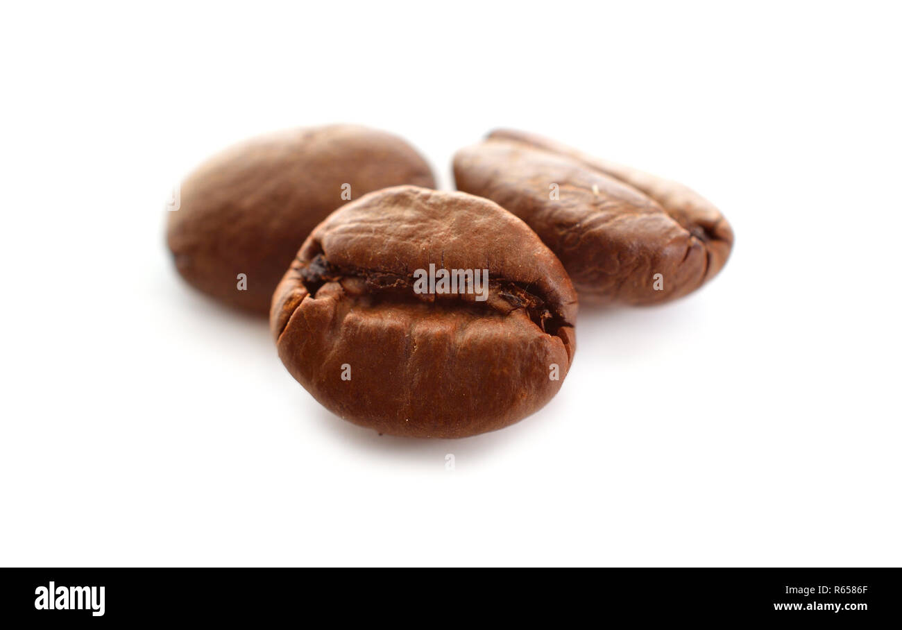 Roasted coffee beans isolated in white background Stock Photo - Alamy