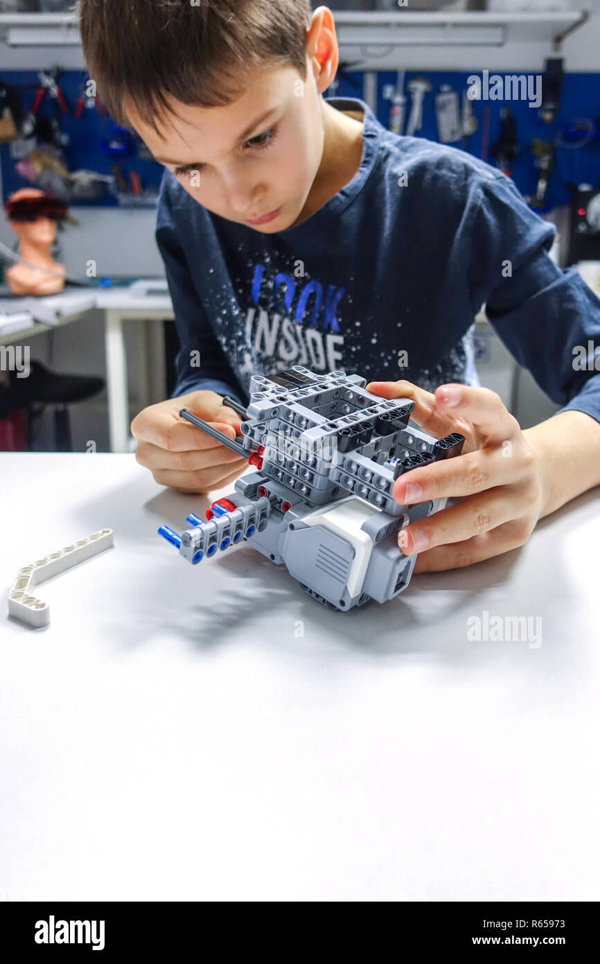 Kid making Lego robot mindstorms. Robotic, learning, technology, stem education for children Stock Photo