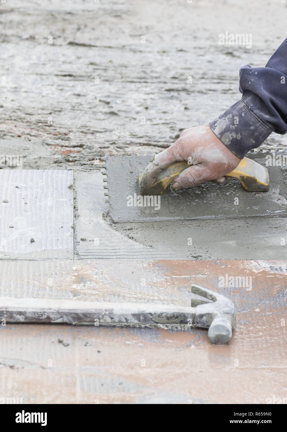 Mason repairing the tiles Stock Photo Alamy
