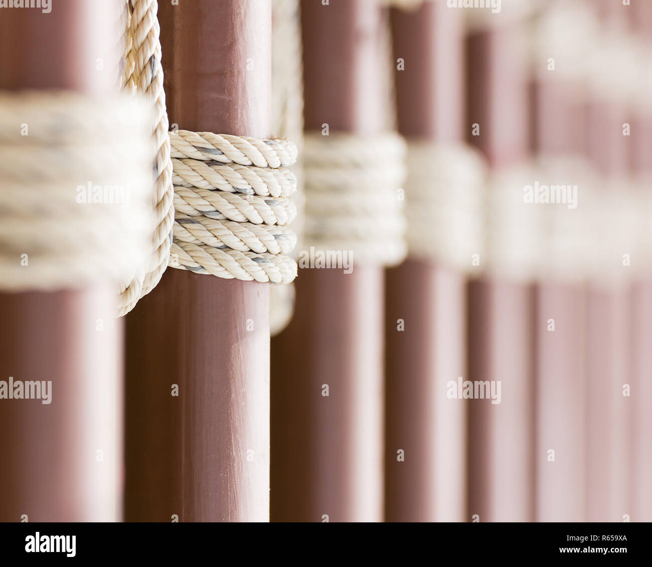 Rope knot around a metal fence Stock Photo Alamy
