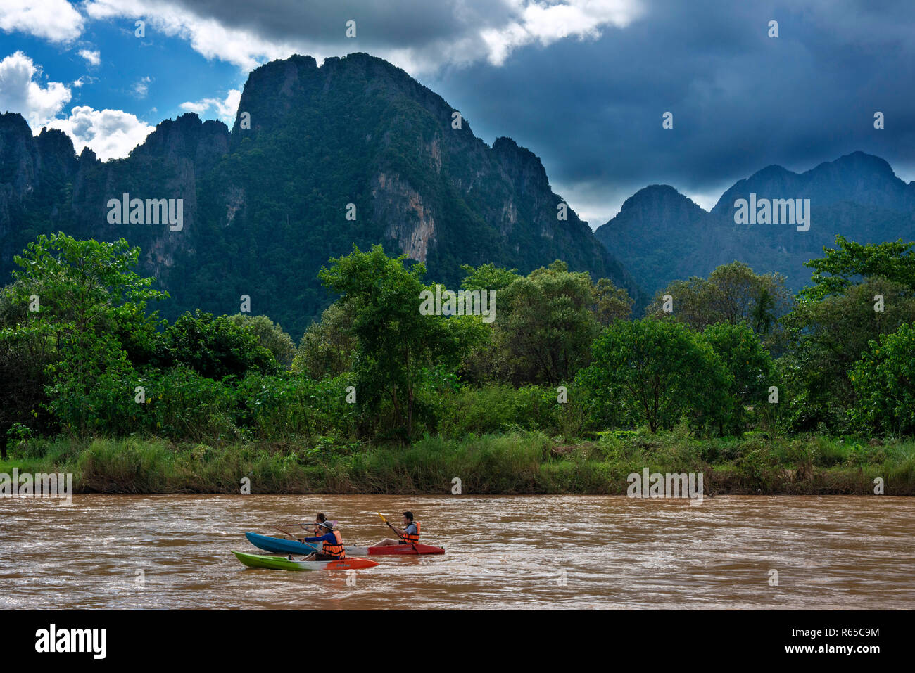 Kayakking in Nam Song river next to Vang Vieng village, Laos Stock Photo