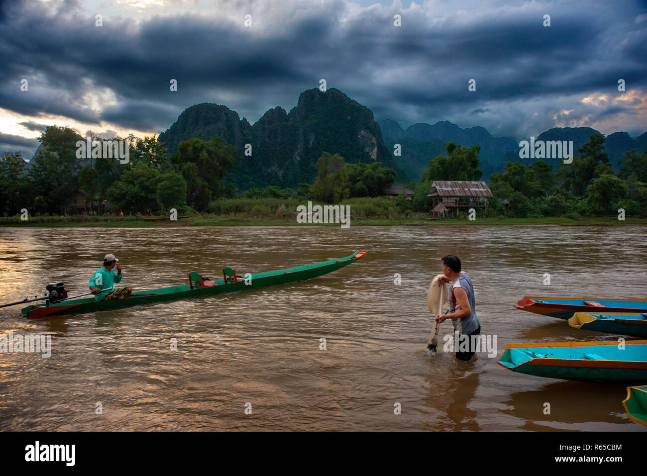 Fishers in Nam Song river next to Vang Vieng village, Laos Stock Photo