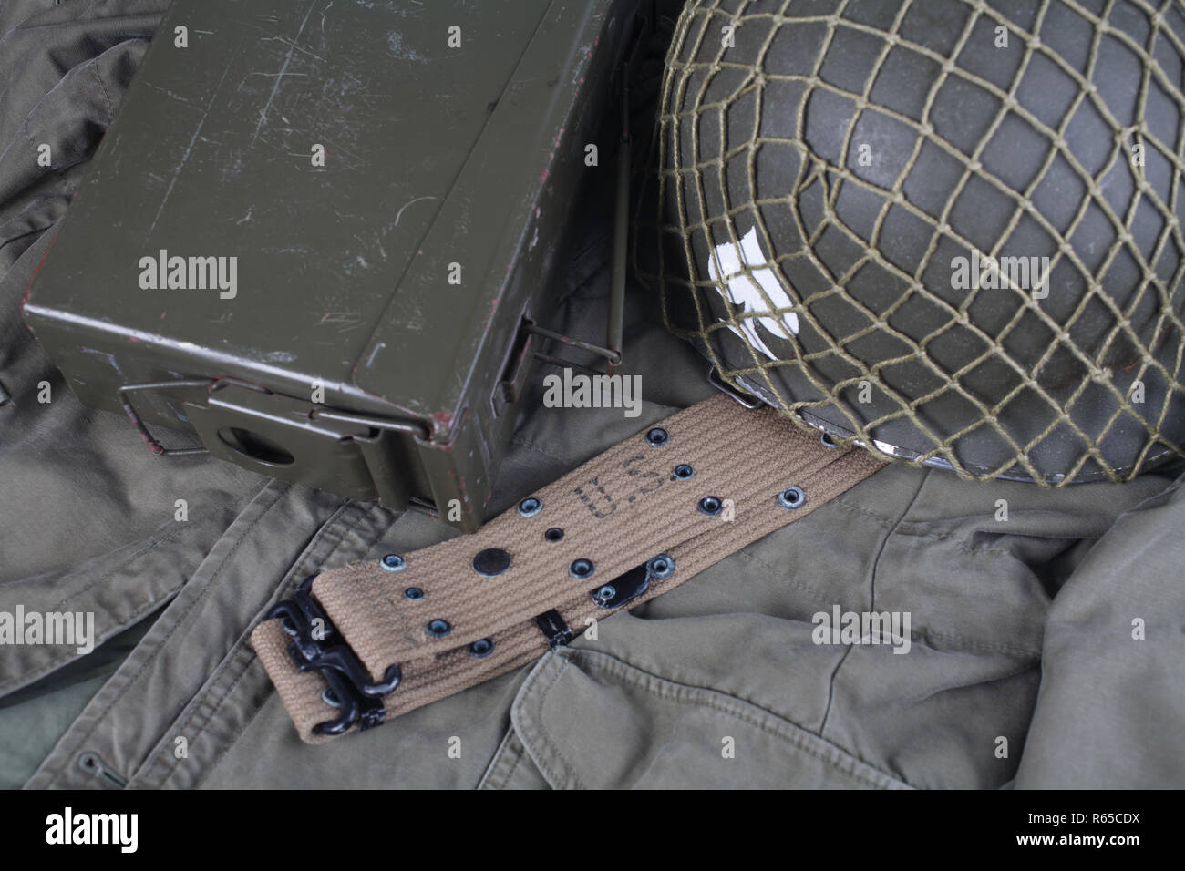 ww2 us army pistol belt and helmet with ace of spades emblem on green ...