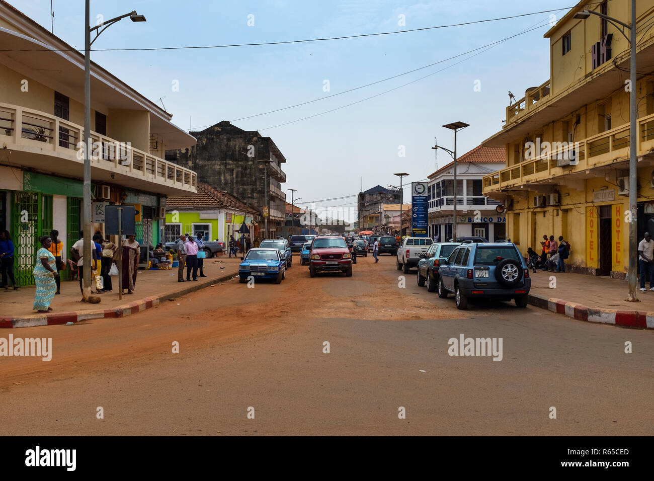 Bissau, Republic of Guinea-Bissau - February 5, 2018: Street scene in the city of Bissau with old taxis and street vendors, in Guinea-Bissau, West Afr Stock Photo