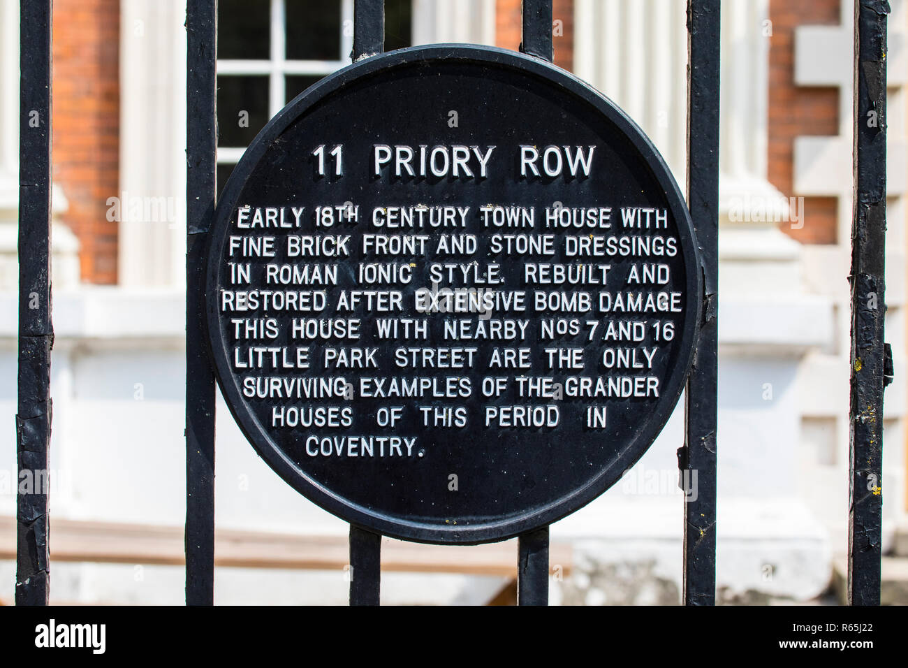 A plaque at 11 Priory Row in the historic city centre of Coventry, UK - detailing the history of the building. Stock Photo