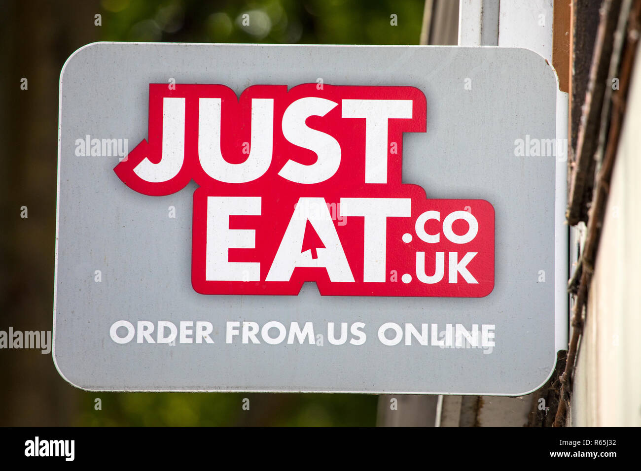 COVENTRY, UK - JULY 26TH 2018: A Just Eat sign outside a takeaway restaurant in the city of Coventry, UK, on 26th July 2018. Stock Photo
