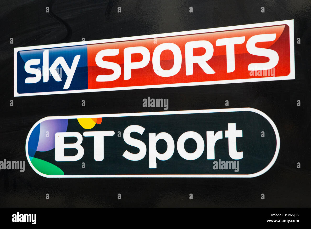 COVENTRY, UK - JULY 26TH 2018: A close-up of the logos for Sky Sports and BT Sport, pictured on a public house sign, on 26th July 2018. Stock Photo