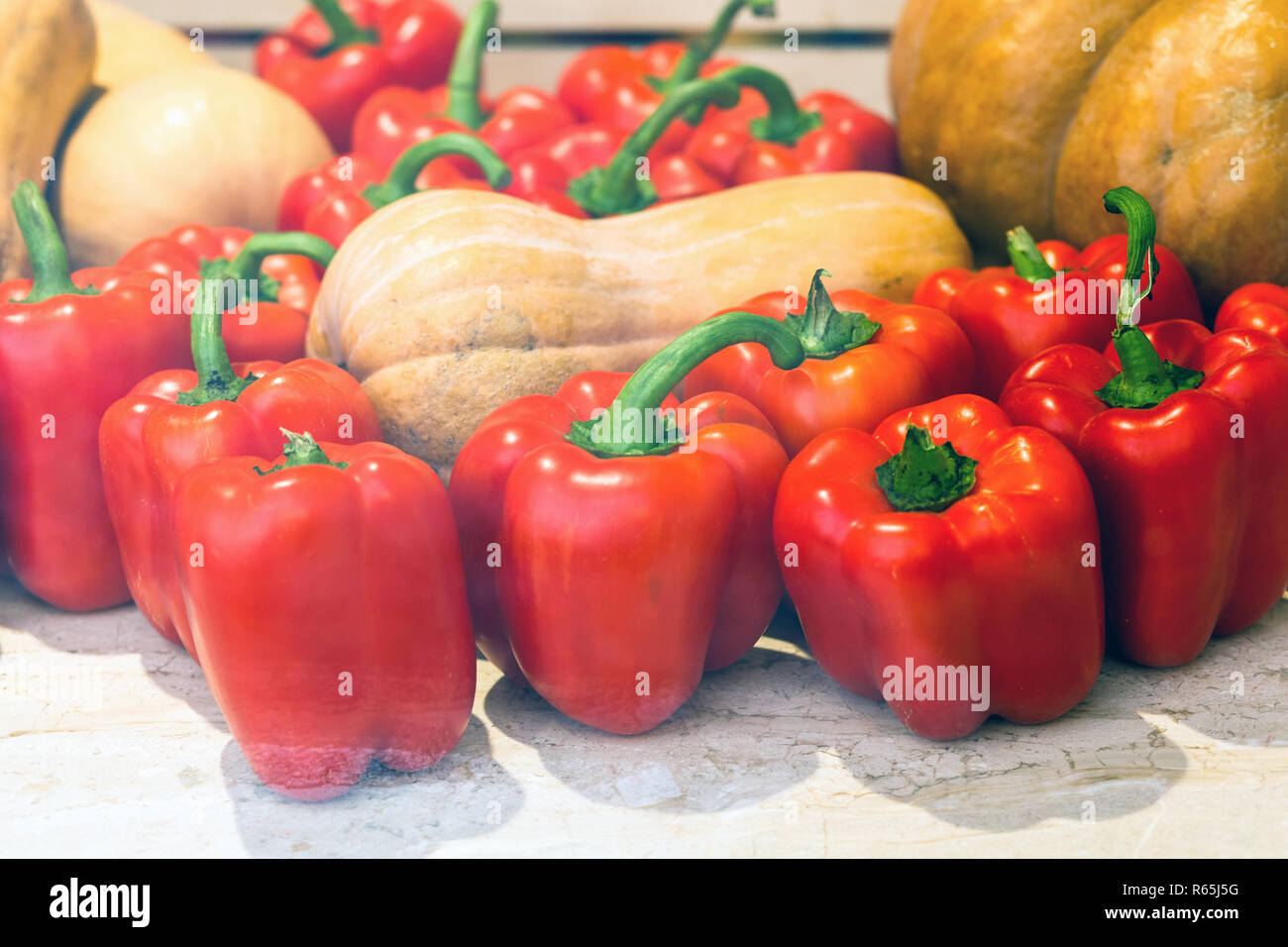 Heap of red peppers among the melons Stock Photo Alamy
