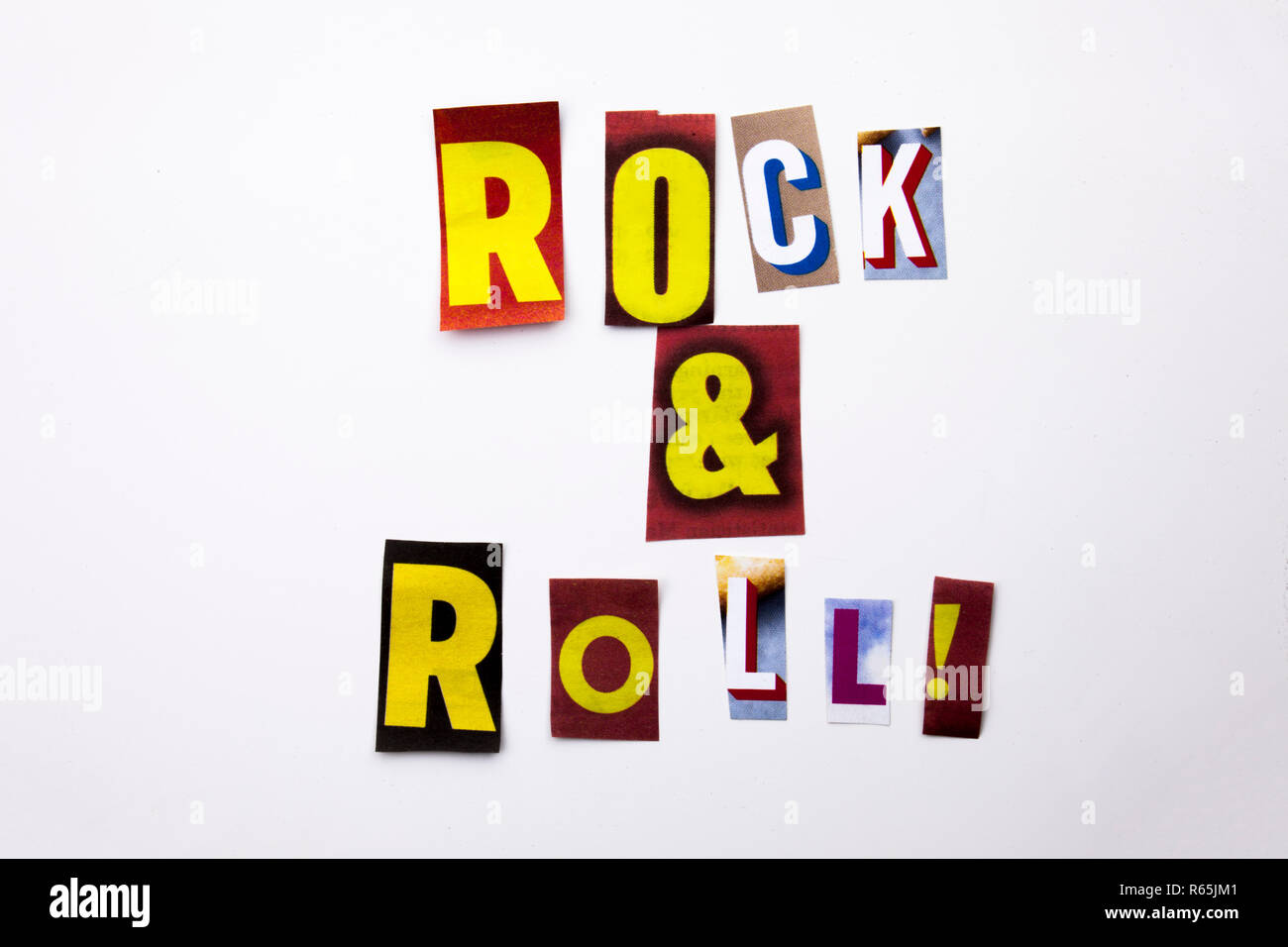 A word writing text showing concept of Rock And Roll made of different magazine newspaper letter for Business case on the white background with copy space Stock Photo