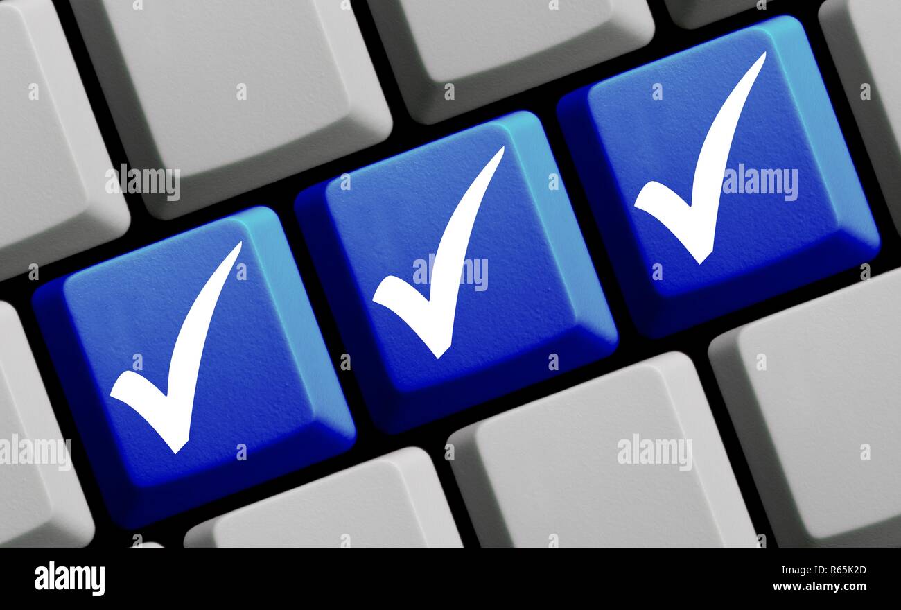 3 check marks on blue keyboard stock photo alamy
