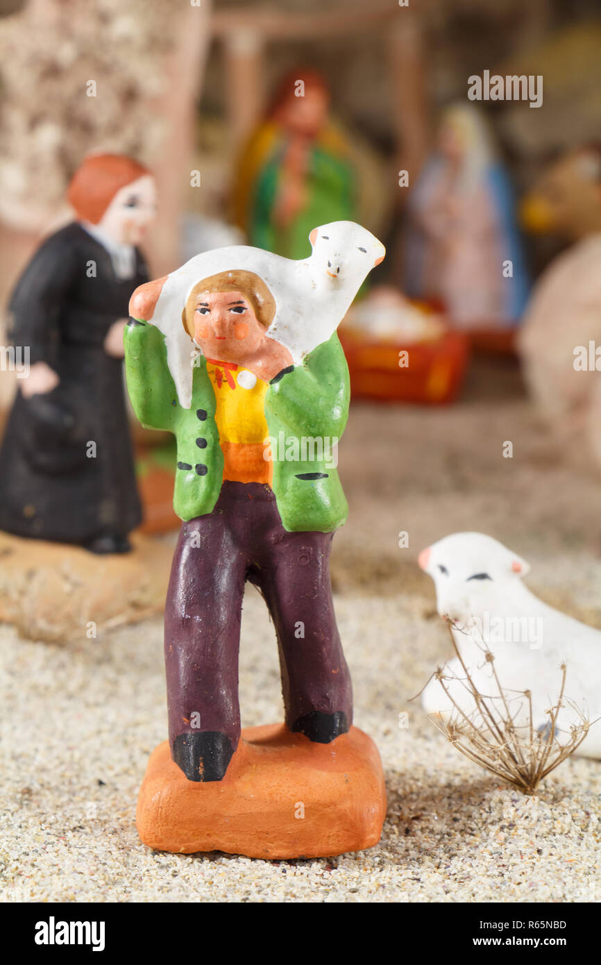 Provencal Christmas crib figure, the shepherd and sheep made in terracotta Stock Photo