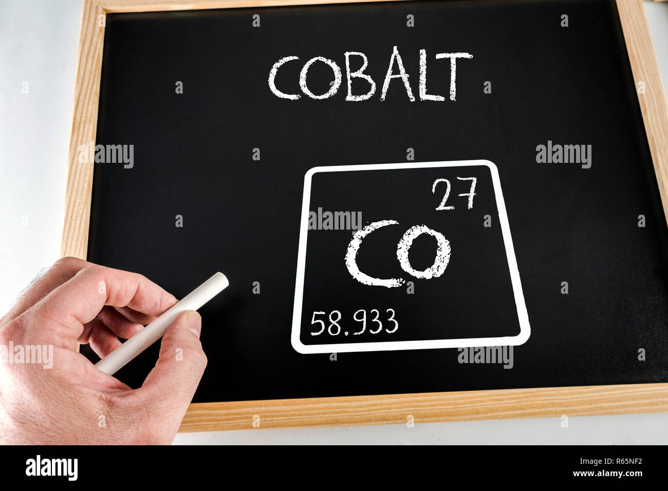Symbol of the chemical element cobalt drawn on a black slate with chalk, conceptual image Stock Photo