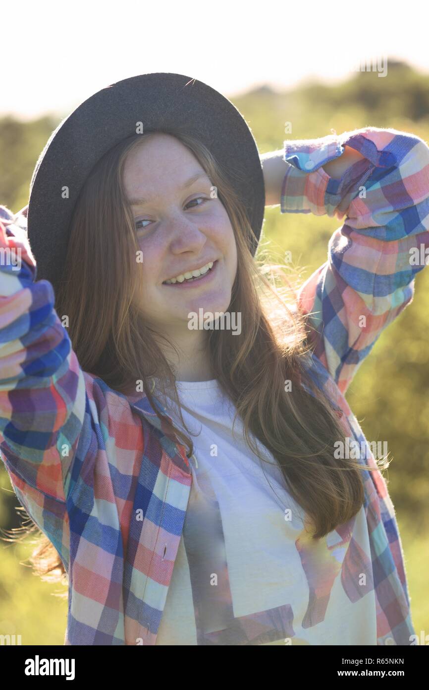 Portrait beautiful teen girl in a hat on the nature Stock Photo - Alamy